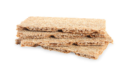 Pieces of crunchy rye crispbreads on white backgroundの写真素材