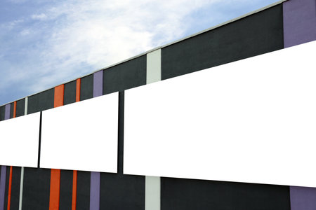 Blank advertising boards on city building. Mockup for designの写真素材