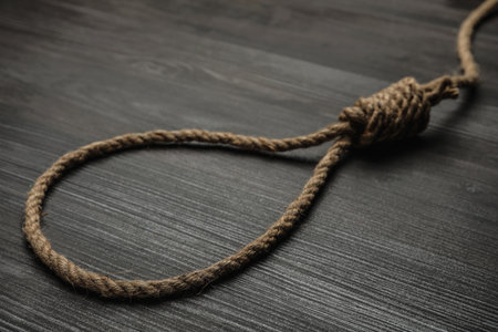 Rope noose on black wooden table, closeupの写真素材