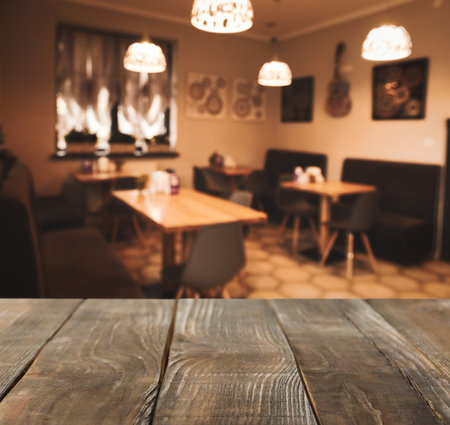 Empty wooden table in cafe. bokeh effectの写真素材