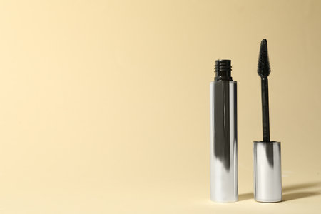 Mascara on beige background, space for textの写真素材