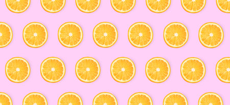Slices of oranges on pink background, flat lay. banner designの写真素材
