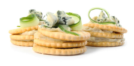 Delicious crackers with cheese and cucumber on white backgroundの写真素材