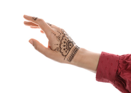Woman with beautiful henna tattoo on hand against white background, closeup. traditional mehndiの写真素材