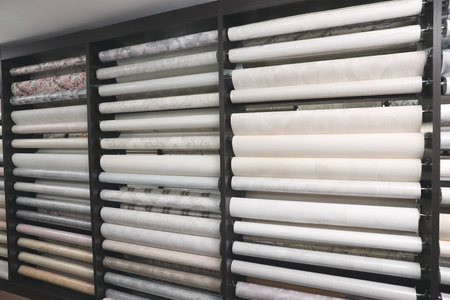 Assortment of stylish wall papers in shopの写真素材