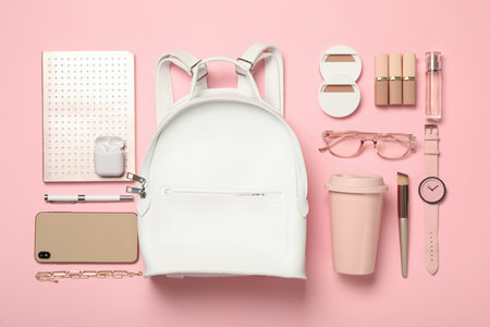 Stylish urban backpack and different items on pink background, flat layの写真素材