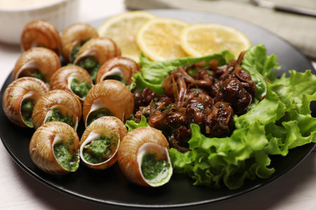 Delicious cooked snails served on white table, closeupの写真素材