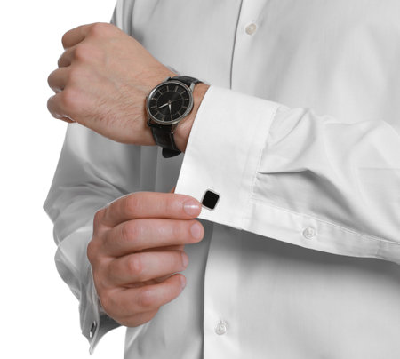 Man wearing stylish shirt and cufflinks on white background, closeup