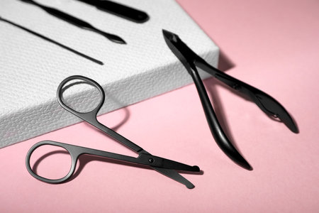 Set of manicure tools on pink background, closeup viewの写真素材