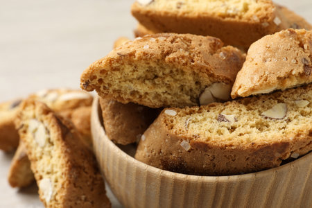 Traditional Italian almond biscuits (Cantucci) in bowl on table, closeupの写真素材