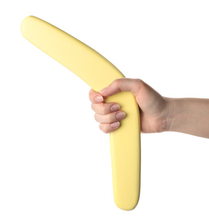 Woman holding yellow boomerang on white background, closeupの写真素材