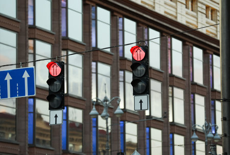 View of traffic lights and road signs in the cityの写真素材
