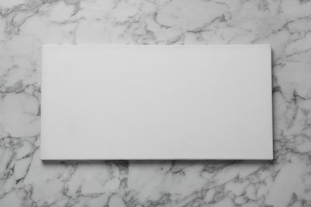 Blank canvas on white marble background, space for textの写真素材