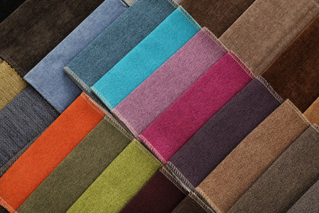 Fabric samples of different colors as background, top viewの写真素材