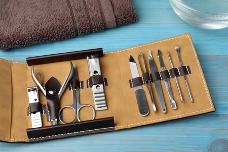 Manicure set in case on light blue wooden backgroundの写真素材