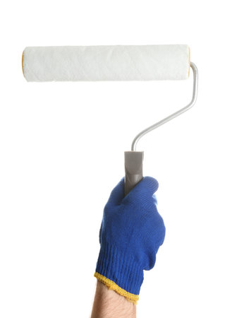 Man holding paint roller brush on white background, closeupの写真素材