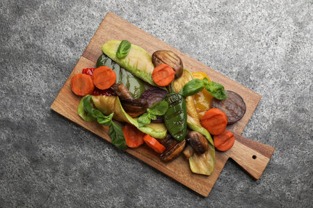 Delicious grilled vegetables on gray table, top viewの写真素材