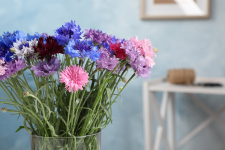 Bouquet of beautiful cornflowers in vase at home, closeupの写真素材