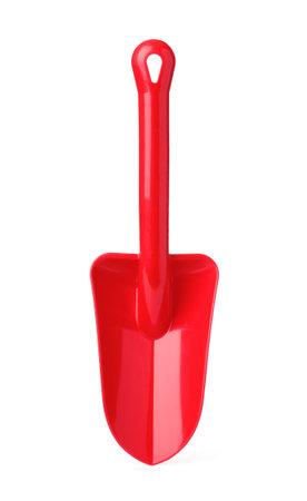Red plastic toy shovel isolated on whiteの写真素材