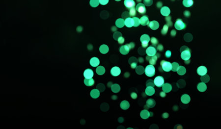 Blurred view of green lights on black background. bokeh effectの写真素材