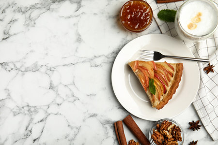 Delicious apple pie served on white marble table, flat lay. Space for textの写真素材