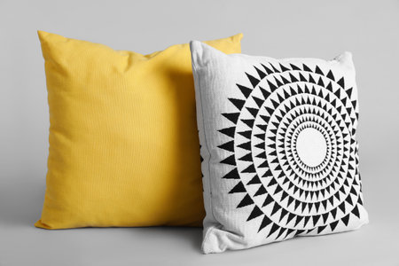 Different stylish soft pillows on gray backgroundの写真素材