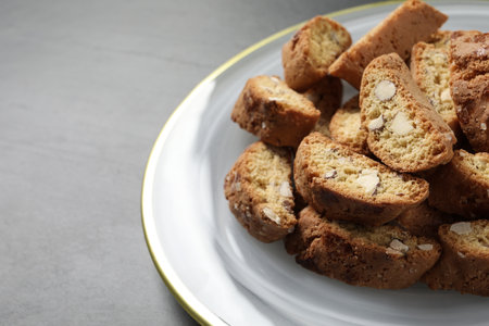 Traditional Italian almond biscuits (Cantucci) on gray table, closeupの写真素材