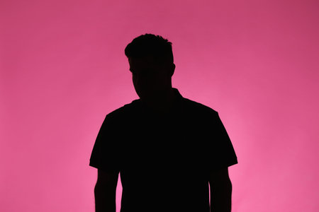 Silhouette of an anonymous man on pink backgroundの写真素材