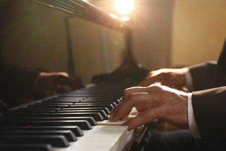 Man playing piano indoors, closeup. talented musicianの写真素材
