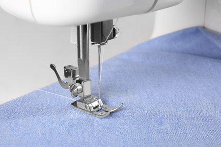 Closeup view of sewing machine with fabricの写真素材