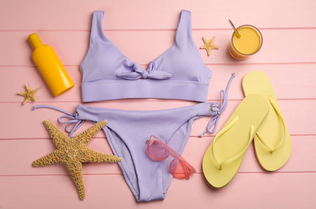 Flat lay composition with beach objects on pink wooden backgroundの写真素材