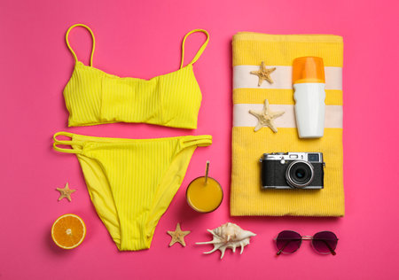 Flat lay composition with beach objects on pink backgroundの写真素材