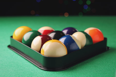 Billiard balls in triangle rack on green table, closeupの素材 [FY310201833723]