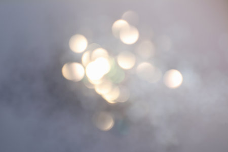 Shiny lilac background with magical bokeh effectの写真素材