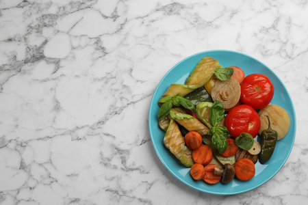 Delicious grilled vegetables on white marble table, top view. Space for textの写真素材