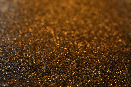 Shiny bronze glitter as background. bokeh effectの写真素材