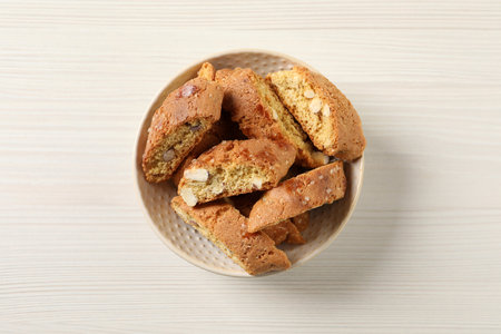 Traditional Italian almond biscuits (Cantucci) on white wooden table, top viewの写真素材