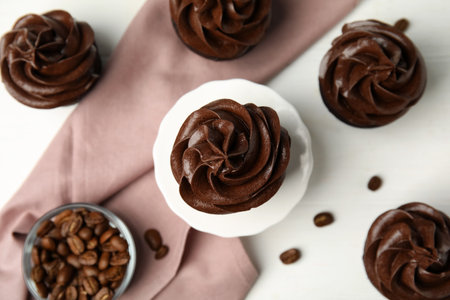 Flat lay composition with delicious chocolate cupcakes on white tableの写真素材