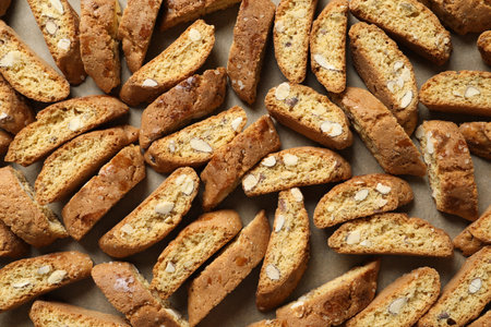 Traditional Italian almond biscuits (Cantucci) on parchment paper, top viewの写真素材