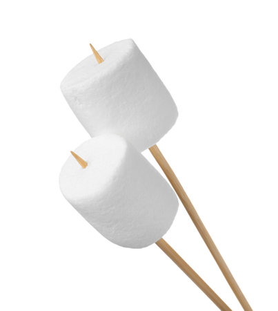 Sticks with delicious puffy marshmallows on white backgroundの写真素材