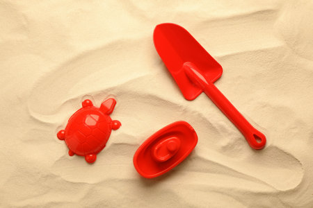 Beach toy kit on sand, flat lay. outdoor playの写真素材