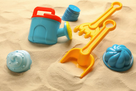 Colorful beach toy kit on sand. outdoor playの写真素材