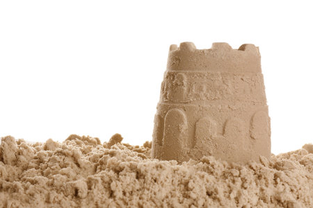Pile of sand with castle on white background. outdoor playの写真素材