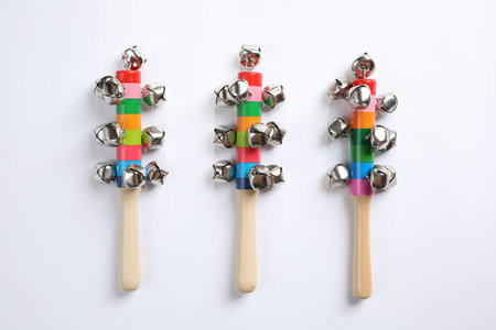 Wooden shakers with bells on white background, top view. Montessori musical toyの写真素材