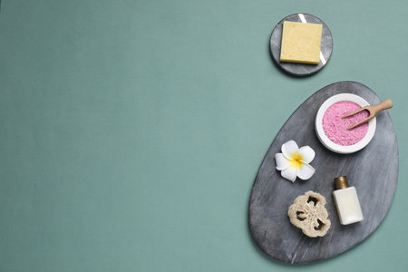 Flat lay composition with spa items on pale green background, space for textの写真素材