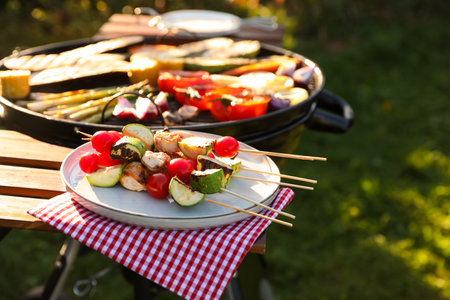 Cooked food products and grill barbecue outdoorsの写真素材