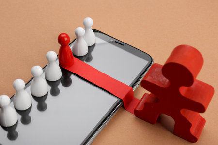 Recruitment process, job competition concept. Red pawn among white ones as best applicant chosen by human figure on beige backgroundの写真素材