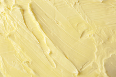 Texture of tasty homemade butter as background, top viewの写真素材