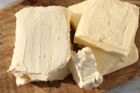 Tasty homemade butter on wooden board, closeupの写真素材