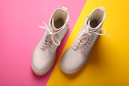Pair of stylish leather shoes on color background, flat layの写真素材